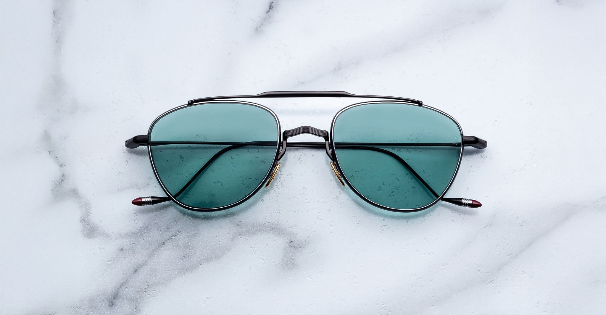 Jacques Marie Mage Flynn aviator sunglasses shown from above, displaying frame details and lens shape.
