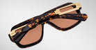 Jacques Marie Mage Fugue tortoiseshell sunglasses with gold accents and brown UV lenses, front angle view.