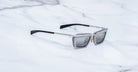 Jacques Marie Mage Gaspard sunglasses in black and silver with gray UV lenses, shown from above.