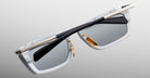 Close-up of Jacques Marie Mage Gaspard rectangular sunglasses showing white frames, black temples, and gold hinges.