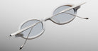 Jacques Marie Mage Balthazar white oval sunglasses with silver arms, back view.