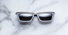 Jacques Marie Mage Gaspard silver and black square sunglasses, top view showing frame shape and colors.