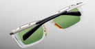 Jacques Marie Mage Gaspard sunglasses, front view, featuring clear frames, green lenses, gold accents, and black arms.