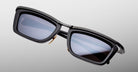 Jacques Marie Mage Gaspard black rectangular polarized sunglasses with dark lenses, front view.