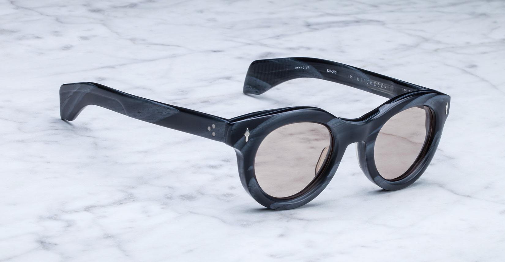 Angled view of the Jacques Marie Mage Hitchcock style sunglasses in colorway Buffalo