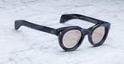 Angled view of the Jacques Marie Mage Hitchcock style sunglasses in colorway Buffalo