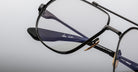 Jacques Marie Mage Hollywood in Brunette with black metal frame, clear lenses, gold nose pads, enhanced view of the bridge
