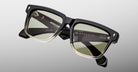 Jacques Marie Mage Hyannis in Black Fade rectangular sunglasses, black frame with green-tinted lenses, front view.
