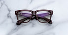 Jacques Marie Mage Hyannis in Bordeaux Empire eyeglasses, dark red rims with burgundy inner arms, viewed from above.