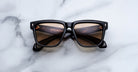 Jacques Marie Mage Hyannis in Noir 15 black square-frame sunglasses with brown lenses, top-view.