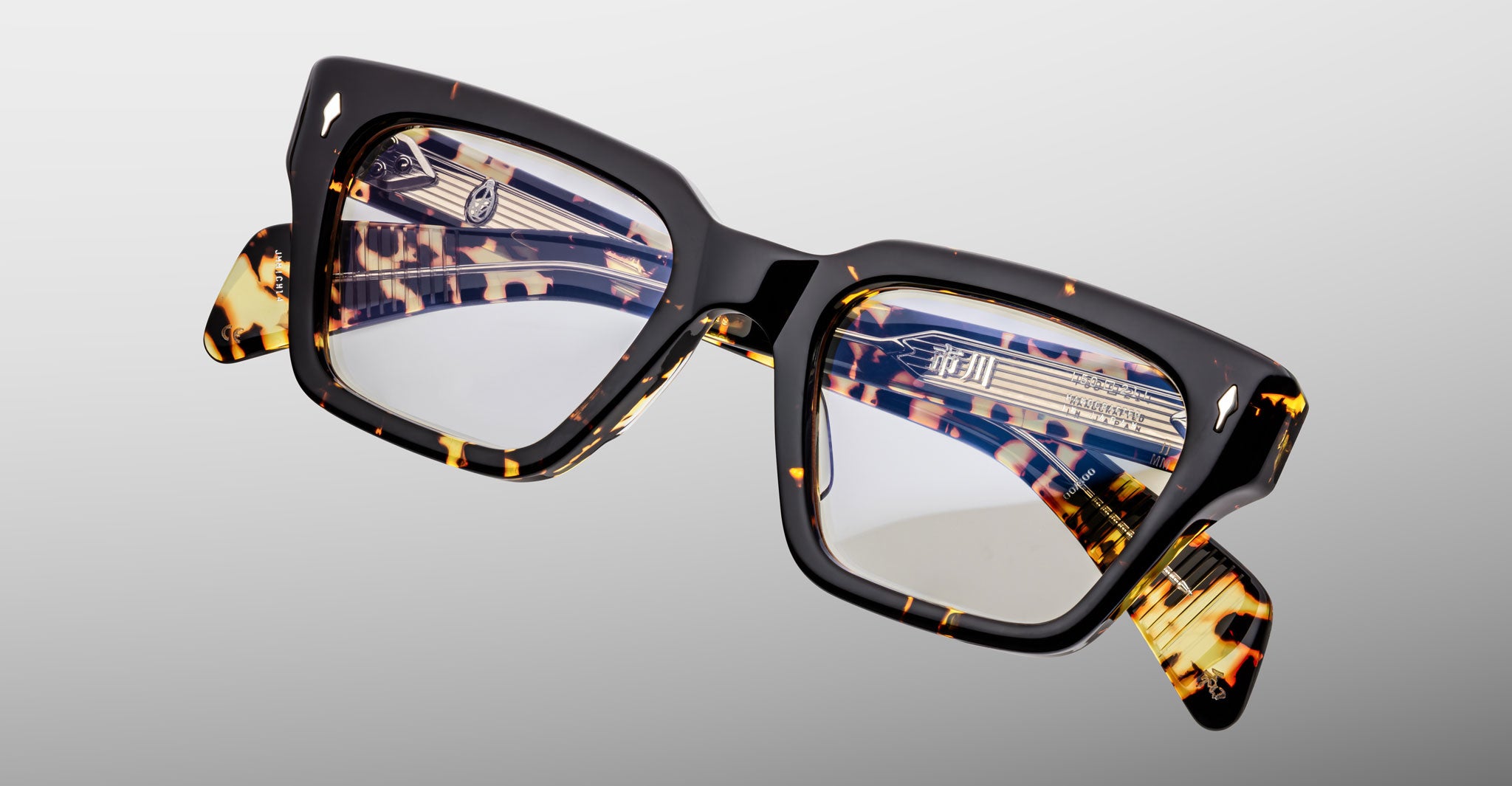 Jacques Marie Mage Ichikawa eyeglasses, rectangular tortoiseshell frame, clear lenses, front view.