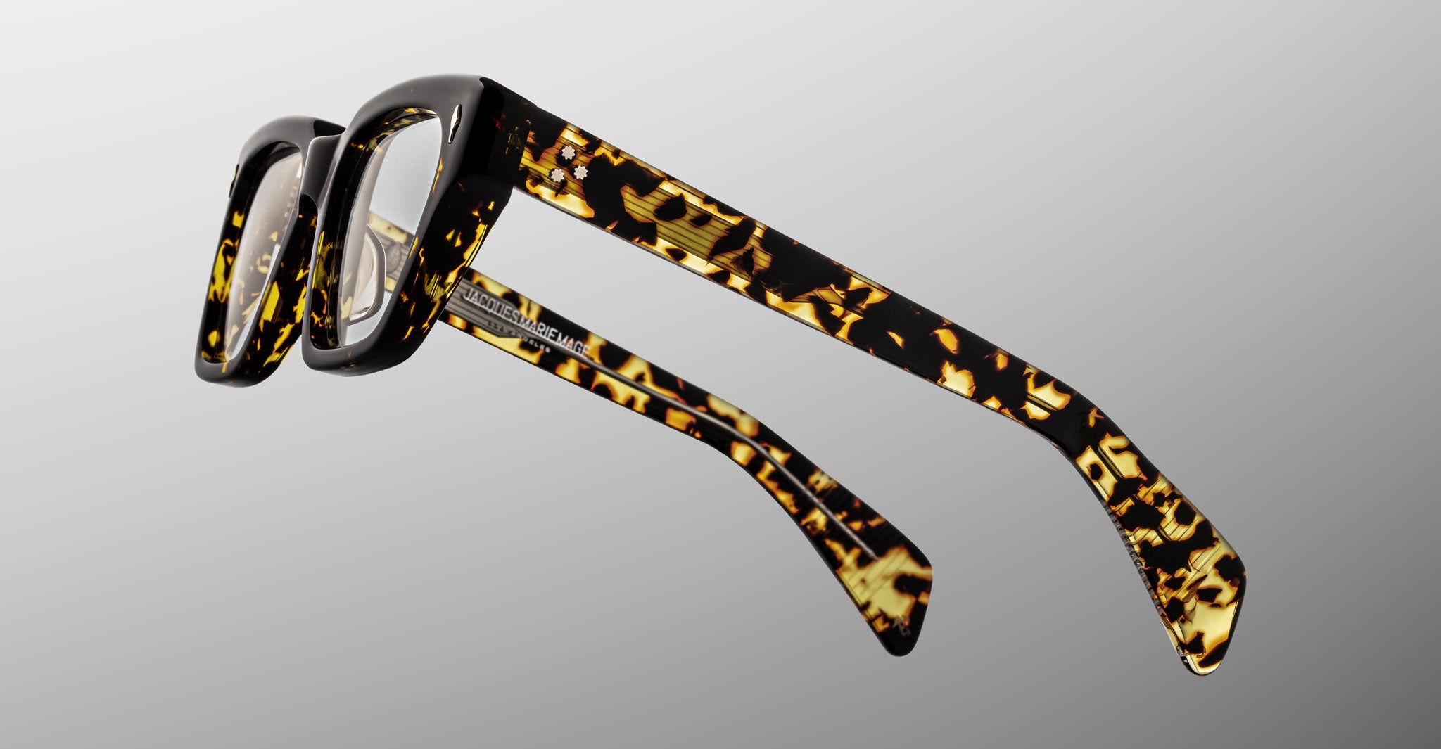 Jacques Marie Mage Ichikawa rectangular eyeglasses, tortoiseshell thick frames, silver hinges, shown from the front.