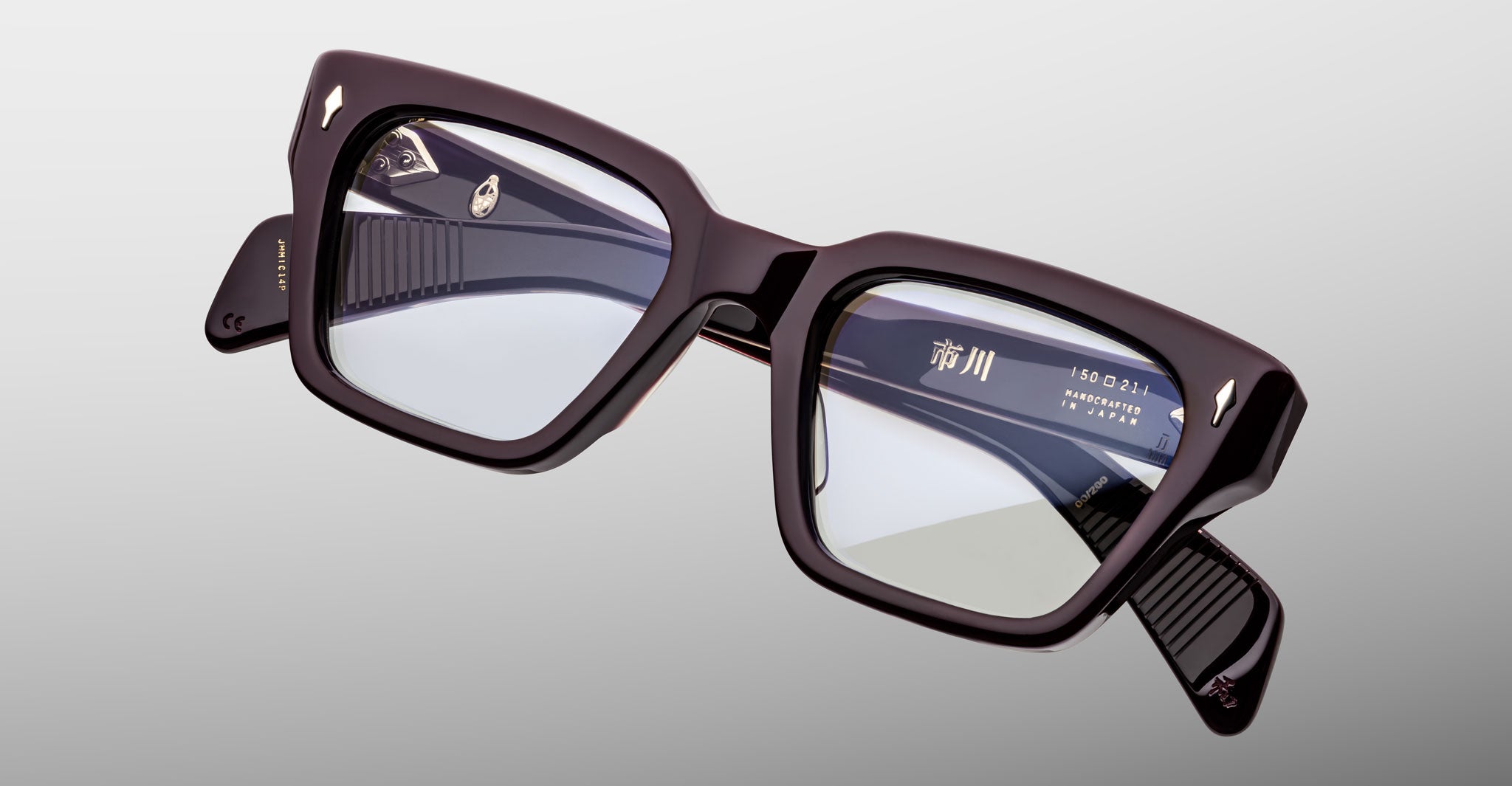 Close-up of Jacques Marie Mage Ichikawa black square eyeglasses with clear lenses, front view.