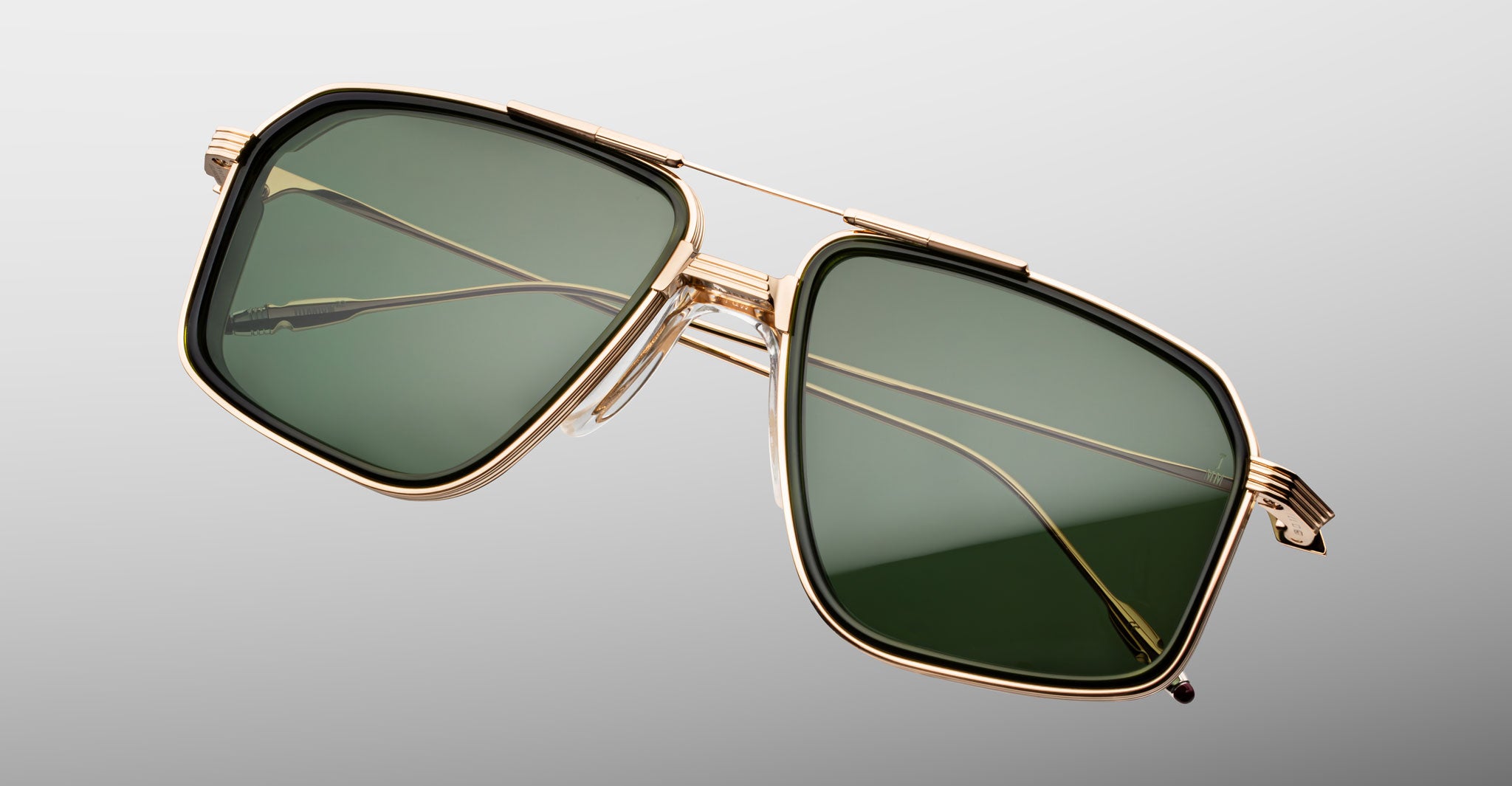 Jacques Marie Mage Jagger sunglasses with gold frames and green rectangular polarized lenses, front view.