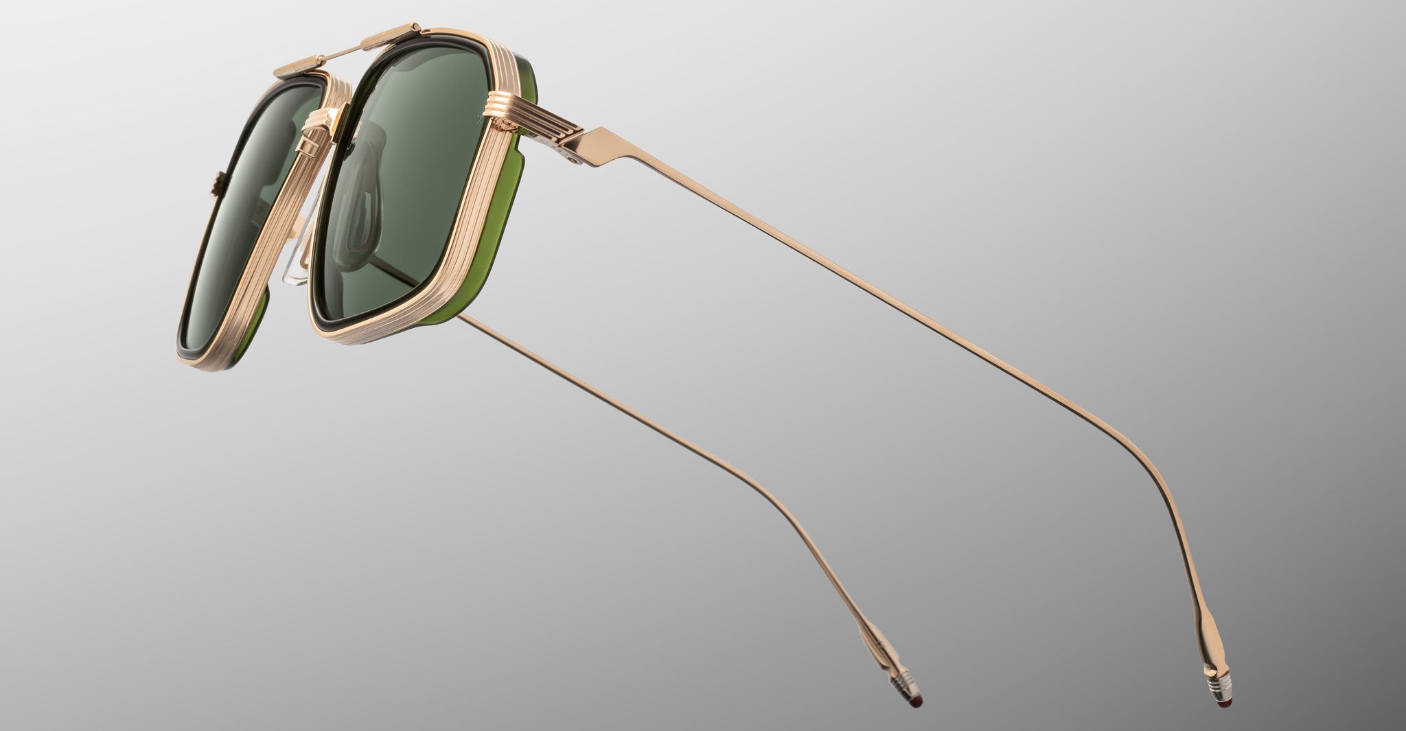 Jacques Marie Mage Jagger gold sunglasses with green lenses and thin arms, front angled view.