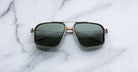 Jacques Marie Mage Jagger sunglasses, green aviator lenses with gold frames, front view.