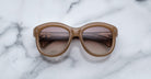 Jacques Marie Mage Jennie round brown sunglasses with tinted lenses, top view.