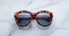 Jacques Marie Mage Jennie sunglasses featuring dark UV lenses, shown from above.