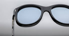 Jacques Marie Mage Jennie black sunglasses with blue lenses, front view, designer eyewear.
