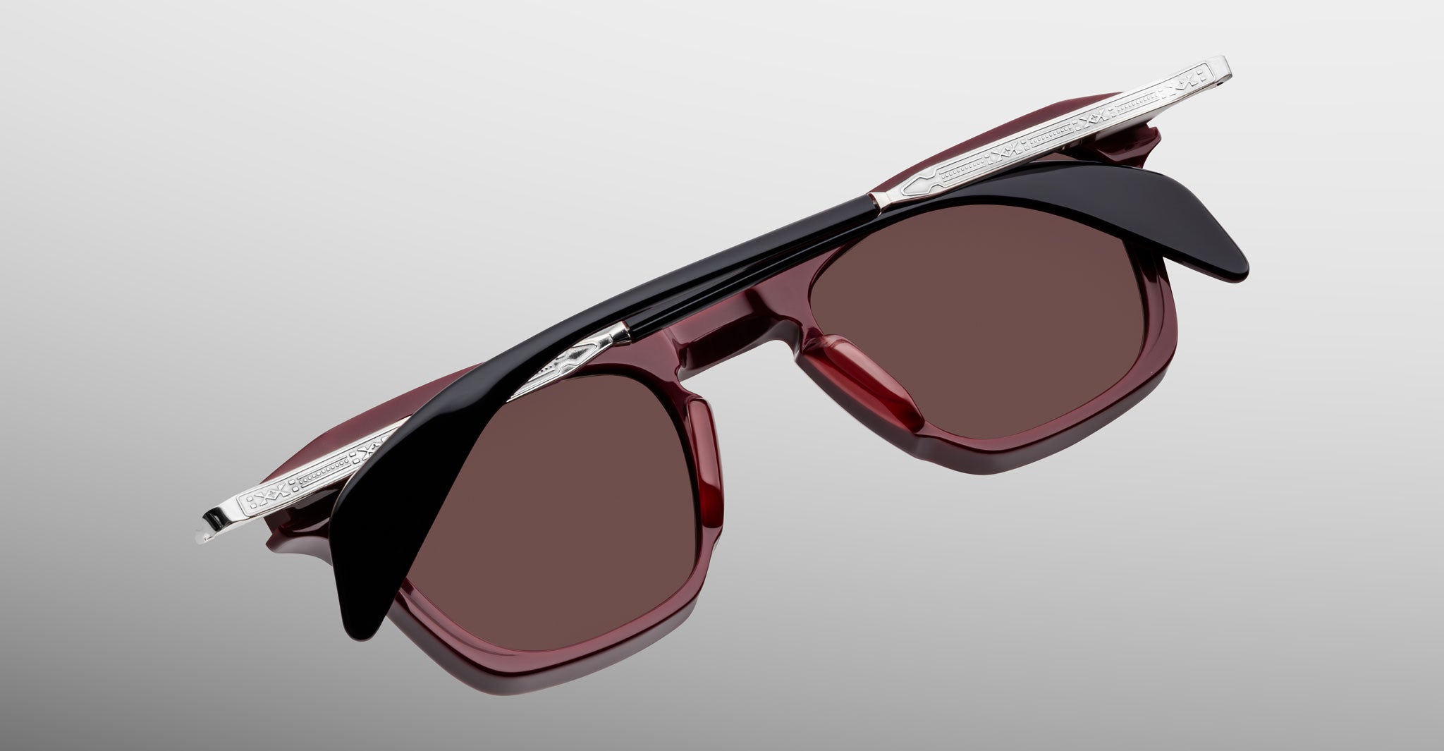 Jacques Marie Mage Kennedy sunglasses, red and black frame with silver arms, top view.