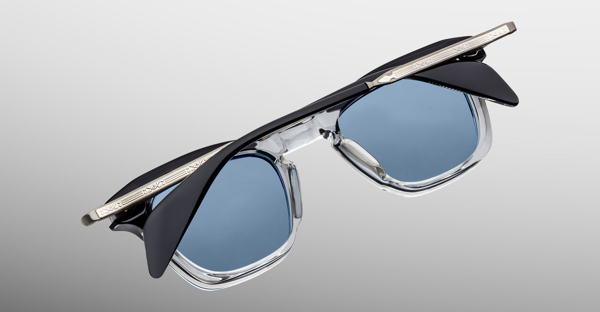 Jacques Marie Mage Kennedy blue-light eyeglasses, black and silver frame, top view.