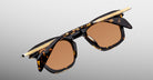 Jacques Marie Mage Kennedy sunglasses, gold temples, brown lenses, front view. Luxury eyewear design for men and women.