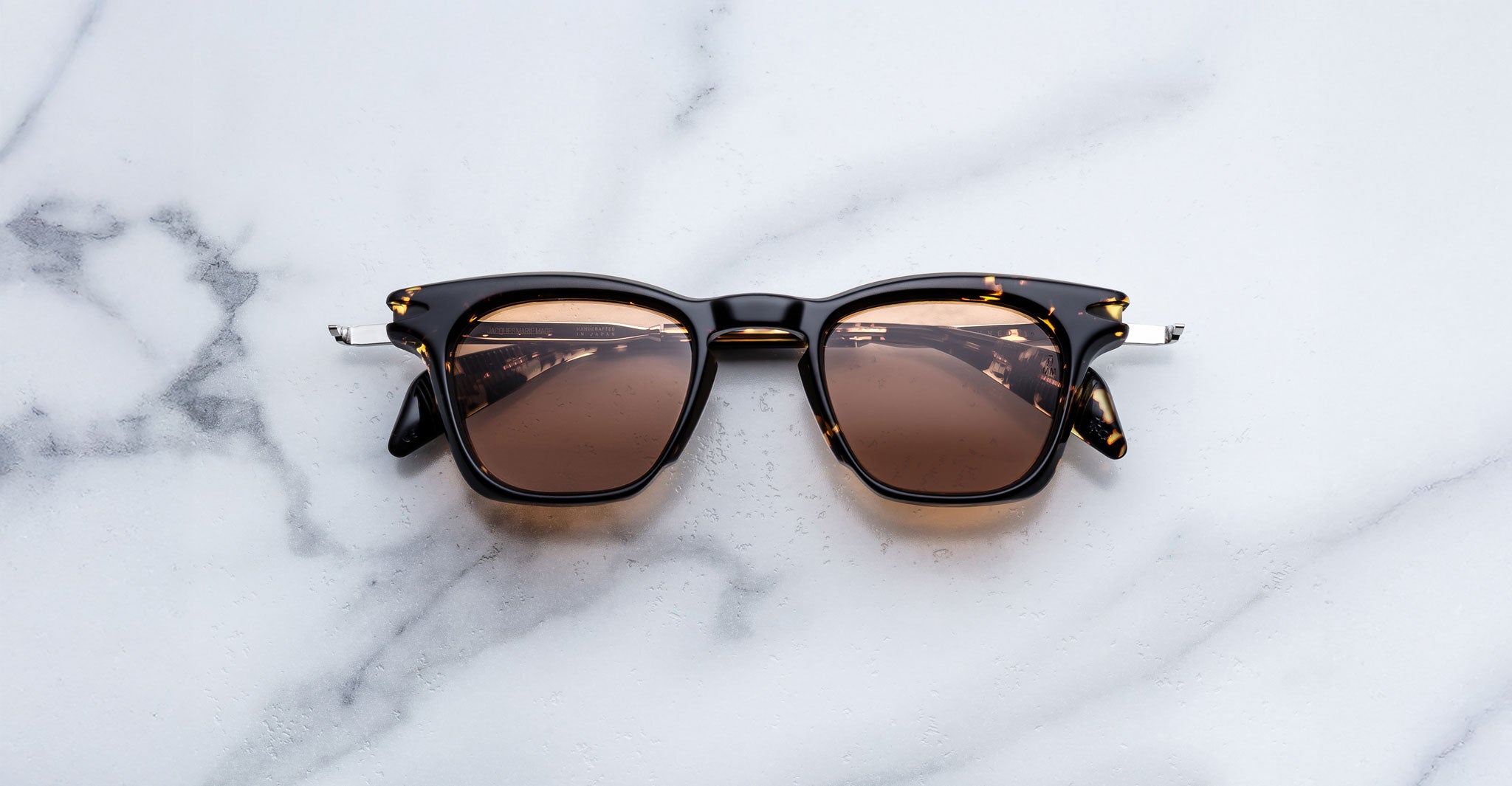 Jacques Marie Mage Kennedy sunglasses with UV-protected brown lenses, top view, showing full frame and lens details.