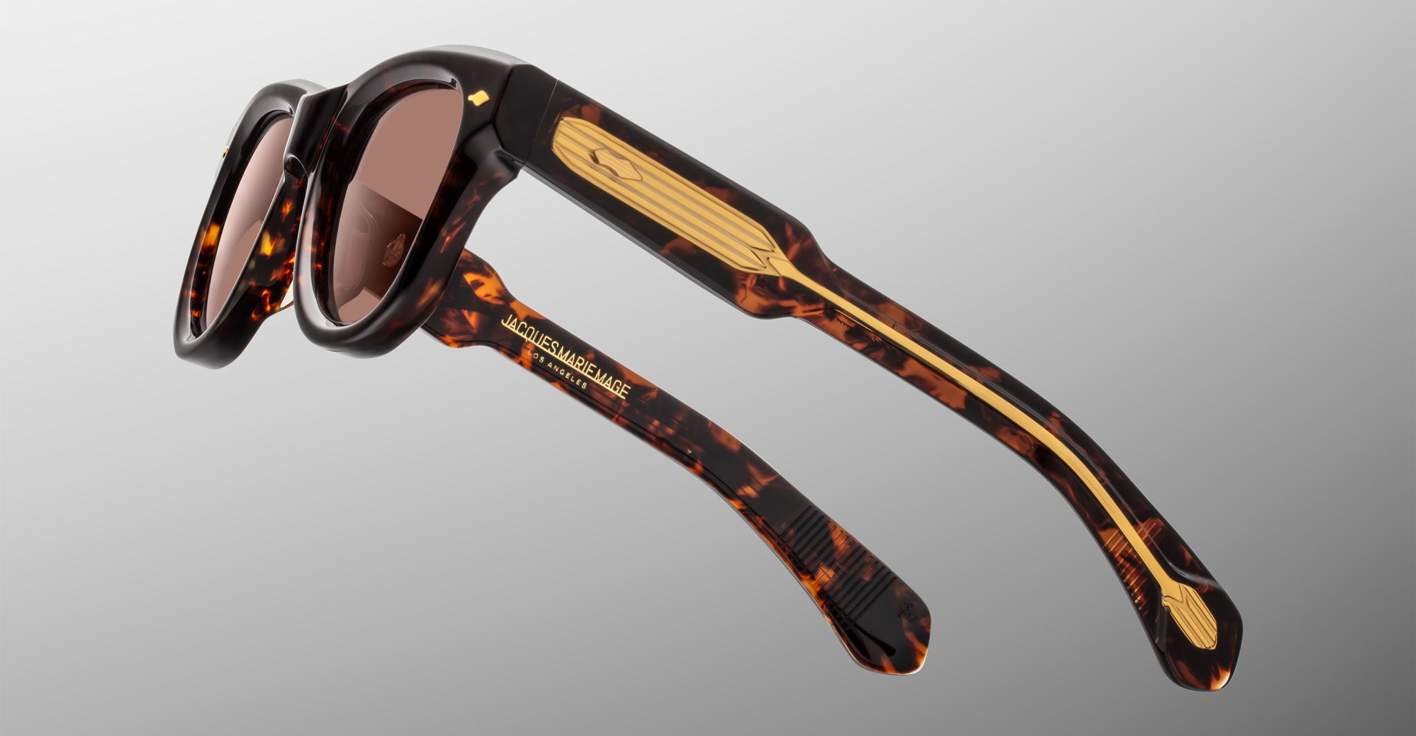 Jacques Marie Mage Kinshasa sunglasses, tortoiseshell frame with gold temples, side view.