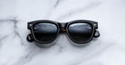 Jacques Marie Mage Kinshasa sunglasses, thick frames, front view showing lenses with soft reflections.