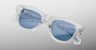Jacques Marie Mage Kinshasa clear-frame sunglasses with blue lenses, front view.
