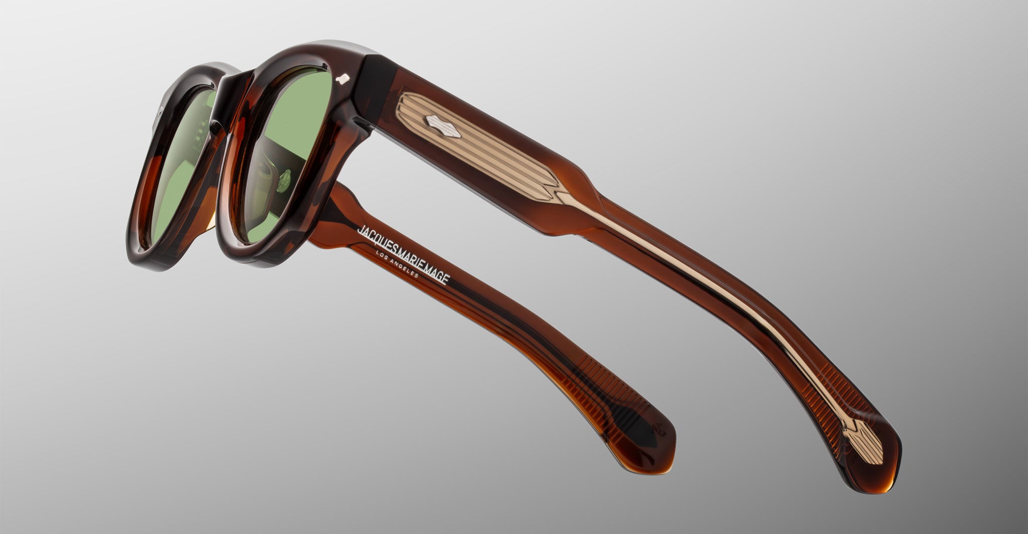 Jacques Marie Mage Kinshasa sunglasses, brown frames, green lenses, metal-accented arms, front view.