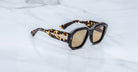 Jacques Marie Mage Lacy sunglasses, thick tortoiseshell frames, gold accents, front view.