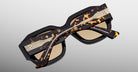 Jacques Marie Mage Lacy sunglasses with thick tortoiseshell frames, gold accents, and brown lenses, shown from the front angle.