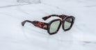 Jacques Marie Mage Lacy tortoiseshell square sunglasses with green lenses, top view.
