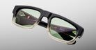 Jacques Marie Mage Louisville sunglasses with green lenses and gradient black-to-clear frames, front view.