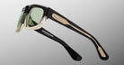 Jacques Marie Mage Louisville sunglasses in black and gold with green lenses, front angle, designer eyewear.