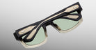 Jacques Marie Mage Louisville black and gold sunglasses with green lenses, folded, product seen from above.
