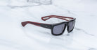 Jacques Marie Mage Louisville rectangular sunglasses in black and red with dark lenses, front view.
