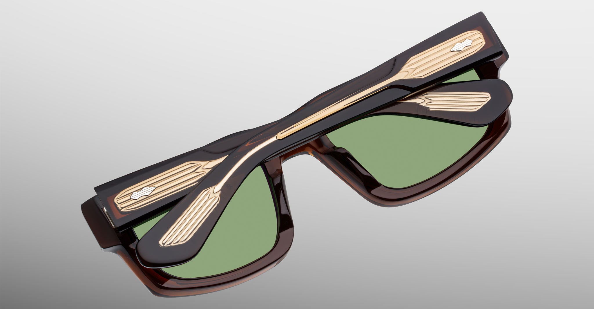 Jacques Marie Mage Louisville sunglasses, dark frame, green lenses, gold temples, foldable design; front view shown.
