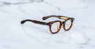 Jacques Marie Mage Matsu round tortoiseshell eyeglasses shown from above, highlighting frame shape and brand details.