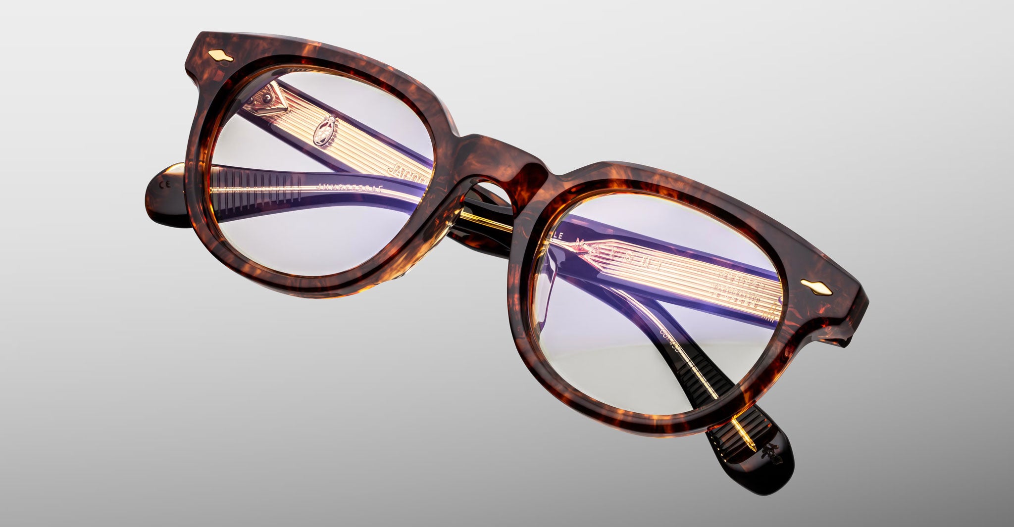 Jacques Marie Mage Matsu round tortoiseshell eyeglasses with gold temple accents, front view.