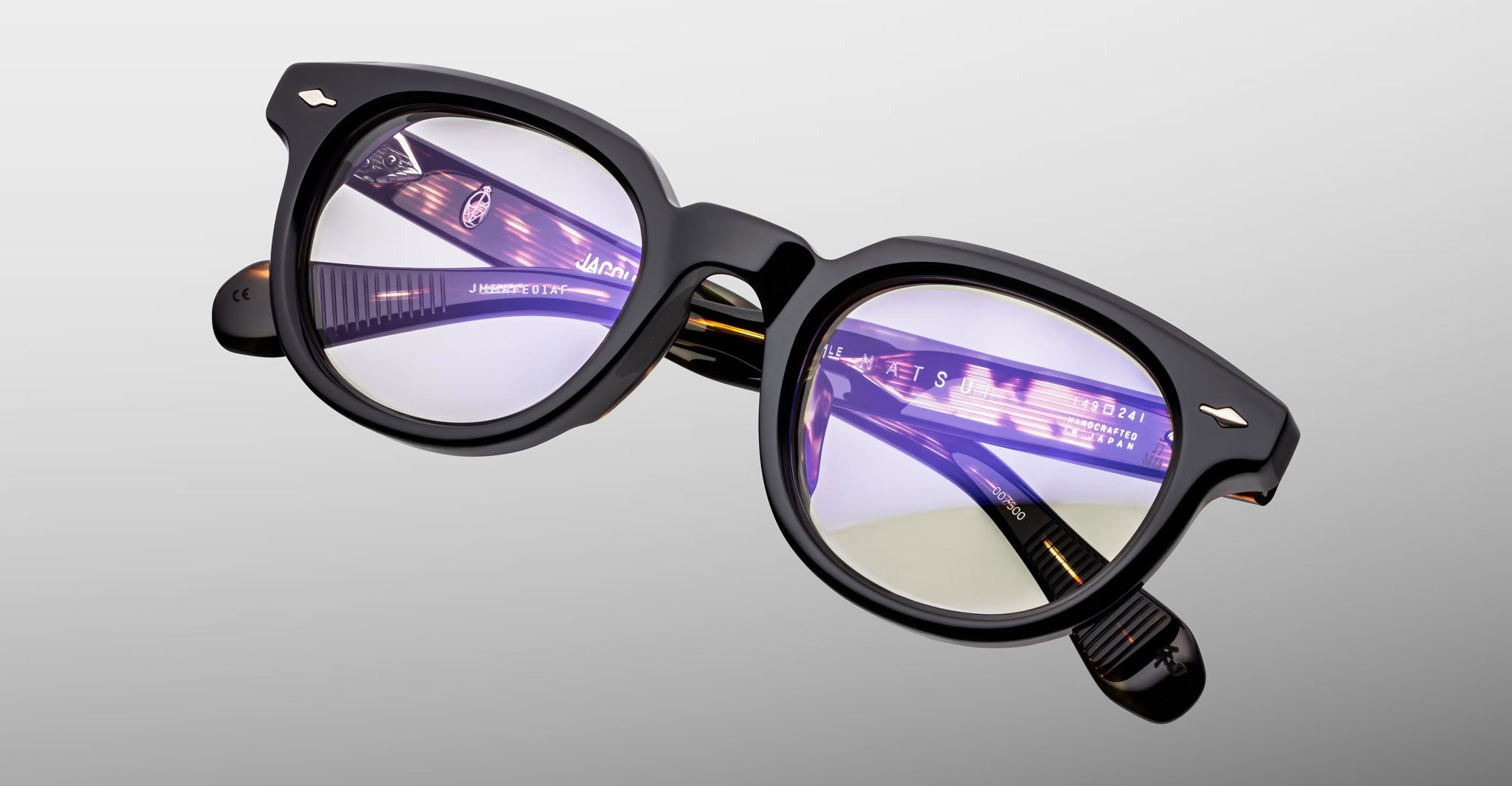 Jacques Marie Mage Matsu black eyeglasses with anti-reflective blue light lenses, front view.