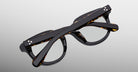 Jacques Marie Mage Matsu eyeglasses, black tortoiseshell acetate frames, folded, top view.