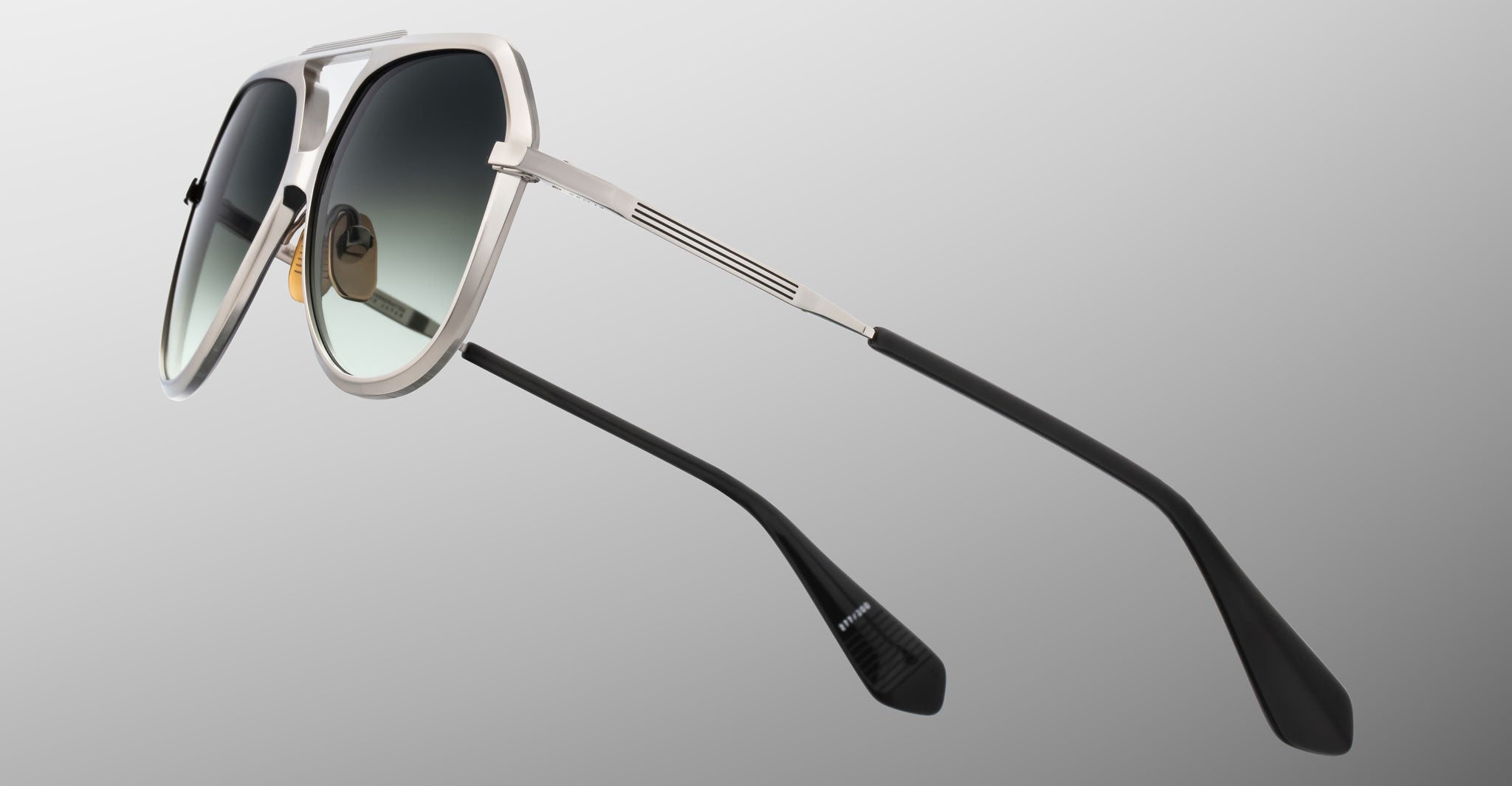 Jacques Marie Mage Maxime aviator sunglasses feature a silver frame, black gradient lenses, and black temple tips, front view.