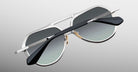 Jacques Marie Mage Maxime aviator sunglasses, silver frames, dark gradient lenses, close-up front view.