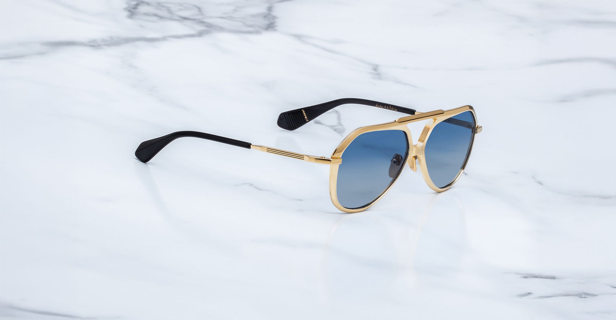 Jacques Marie Mage Maxime aviator sunglasses with polarized blue lenses and black arms, front view.