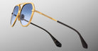 Jacques Marie Mage Maxime sunglasses, gold frame, blue gradient lenses, black arms, front view.