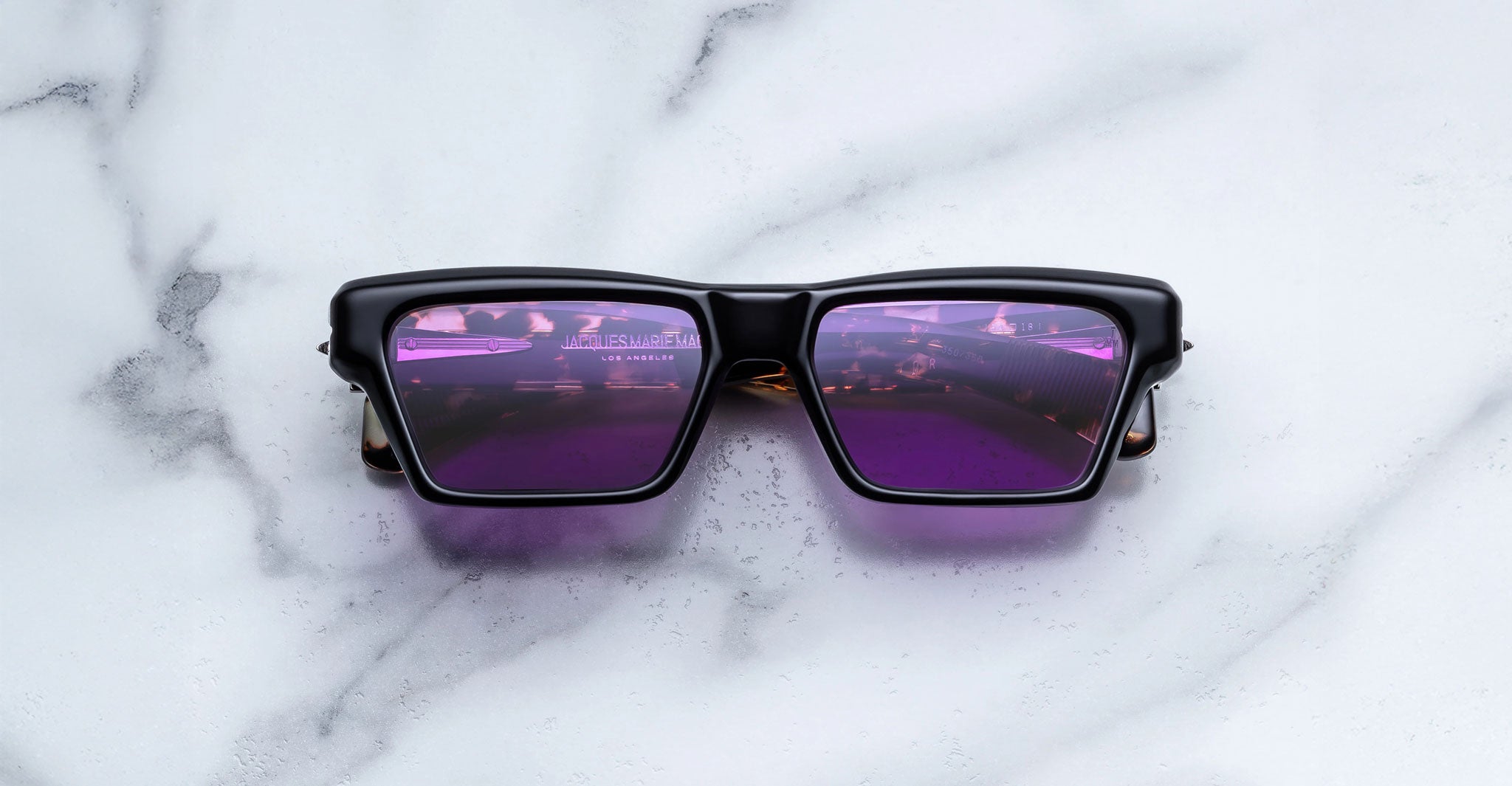 Jacques Marie Mage Melchior black rectangular sunglasses with purple lenses, front view.