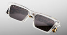 Jacques Marie Mage Melchior sunglasses with clear frames, dark square lenses, and tortoiseshell arms shown from a front angle.