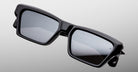 Jacques Marie Mage Melchior sunglasses, black rectangular frames, thick design, UV-protective dark lenses, front view.